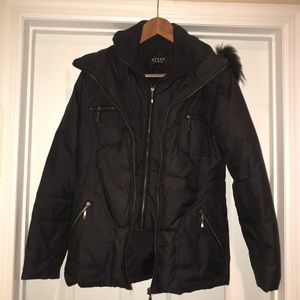A black winter parka with a fur hood